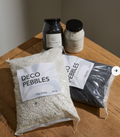 22571.55L Deco Pebbles 22lb Black